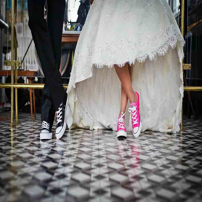 male and woman feet putting on same shoes